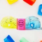Multicolor Magic Smiley Spring Toy (12 Pcs Set) Fun, Portable Slinky Spring Toy for children, stylish for Birthdays and Playtime - Image 5